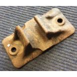 A heavy GWR cast iron track clip. Est. £15 - £20.