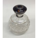 A silver and tortoiseshell scent bottle with inlai