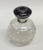 A silver and tortoiseshell scent bottle with inlai