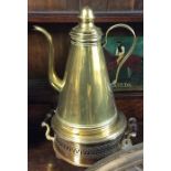 A large tapering brass hot water jug on stand with