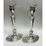 A large pair of silver boat shaped candlesticks. S