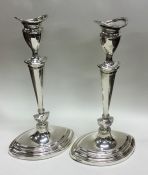 A large pair of silver boat shaped candlesticks. S