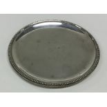 An English Provincial silver counter dish with bea
