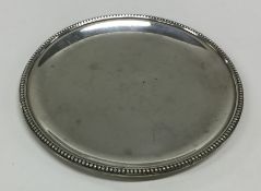 An English Provincial silver counter dish with bea