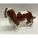 A Beswick figure of a King Charles spaniel in stan