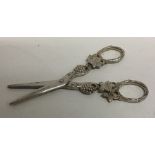 A pair of scroll decorated silver grape scissors d