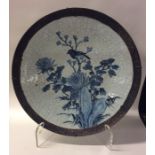 A Chinese blue and white crackleware charger decor