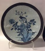 A Chinese blue and white crackleware charger decor