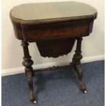 A Victorian hinged top games table with inlaid dec