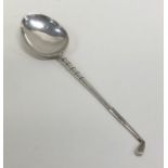 An Edwardian silver spoon in the form of a golf cl