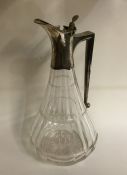 A stylish tapering glass lemonade jug with silver