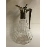 A stylish tapering glass lemonade jug with silver