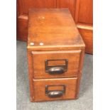 An oak two drawer stationery chest. Est. £20 - £30