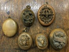 A collection of good carved lockets in relief. Est