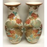 A tall pair of Satsuma vases decorated with gildin