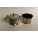 An Edwardian silver two piece cruet on sweeping pe