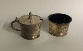 An Edwardian silver two piece cruet on sweeping pe