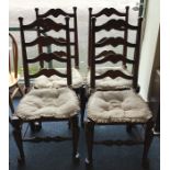 A set of four oak ladder back chairs with turned s