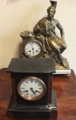 A marble mounted clock with a seated warrior toget