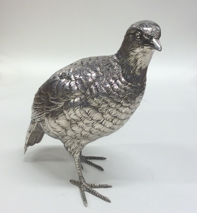 A good silver figure of a quail with textured body