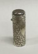 A silver scent bottle decorated with flowers and l