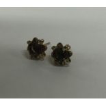 A pair of 9 carat smoky quartz ear studs. Approx.