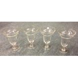 A set of four tapering glass sundae dishes etc. Es