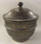 A heavy Chinese brass tapering urn and cover with