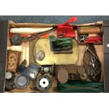 A box containing scales, stamps, scissors etc. Est