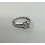 A nine stone diamond cluster ring in claw mount. A