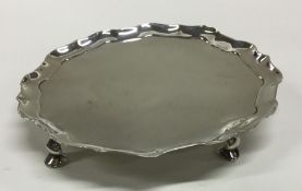 A Georgian silver salver with shaped edge. London