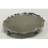 A Georgian silver salver with shaped edge. London