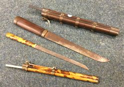 A good Chinese hardwood dagger in matching sleeve,