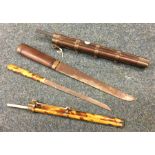 A good Chinese hardwood dagger in matching sleeve,