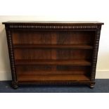 A Victorian mahogany single drawer bookshelf on bu