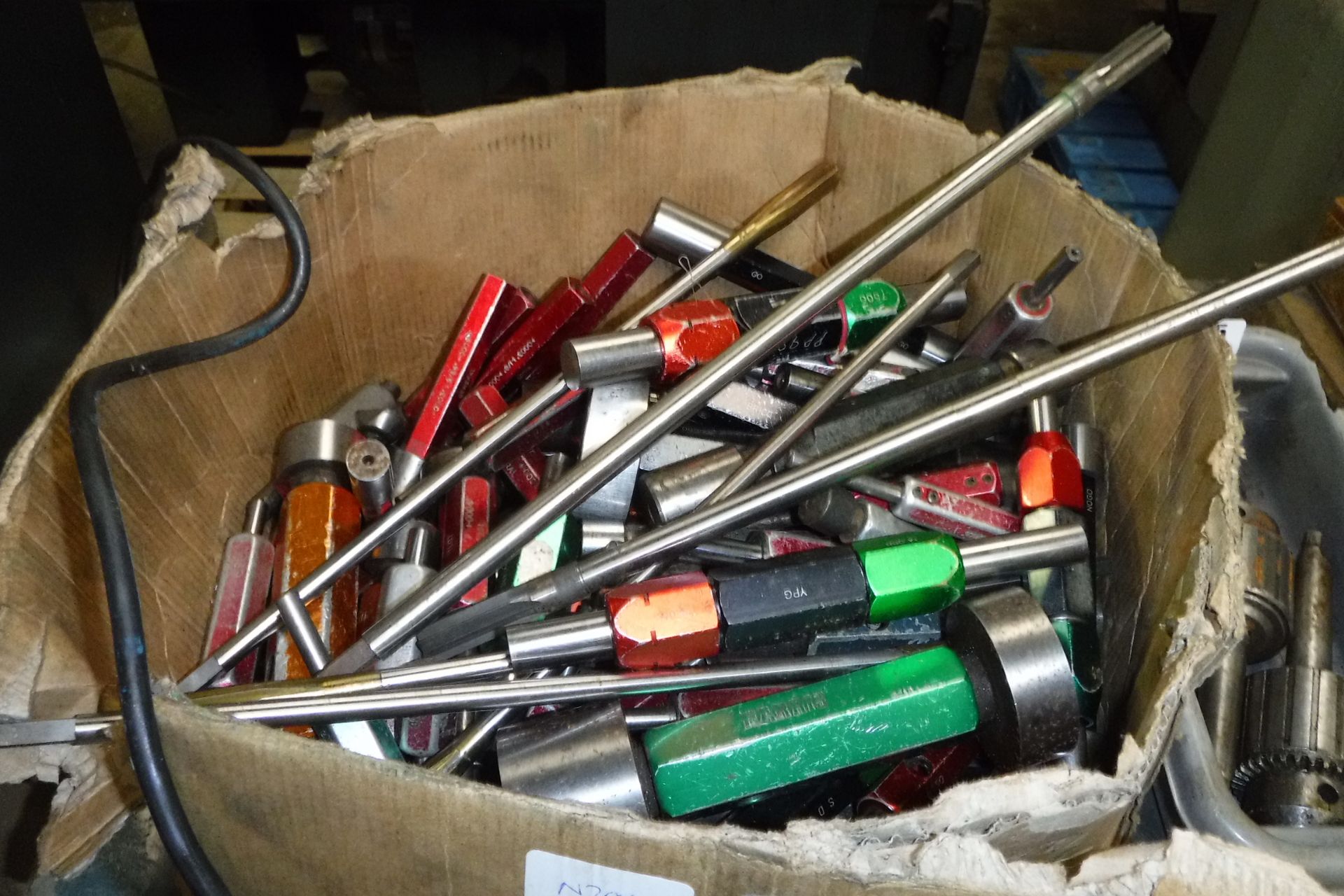 Box of assorted engineering tooling