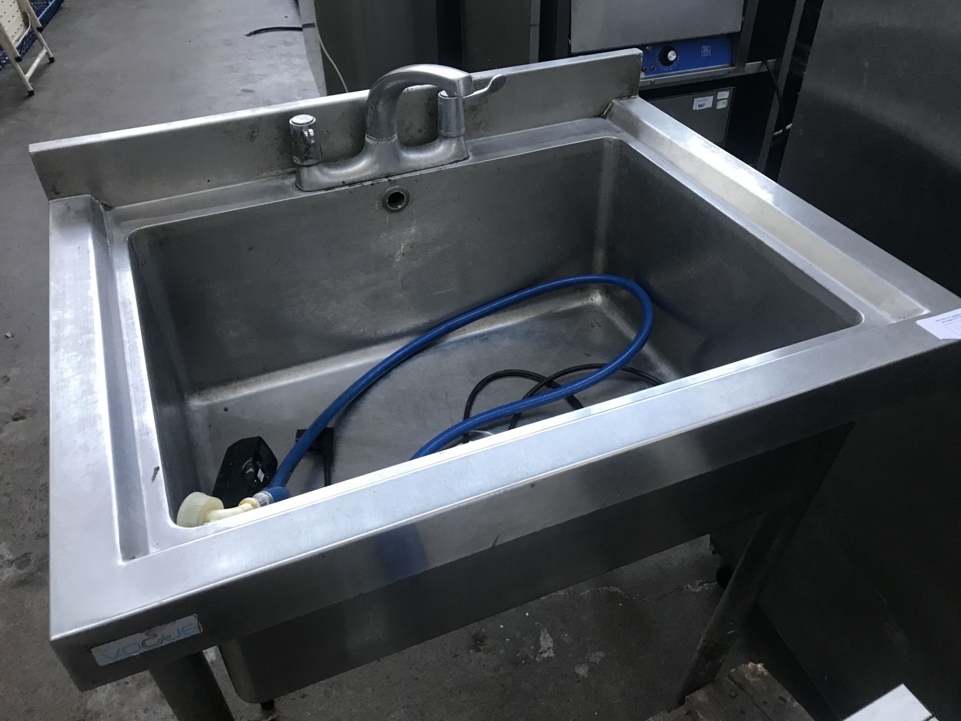Stainless steel single sink with taps