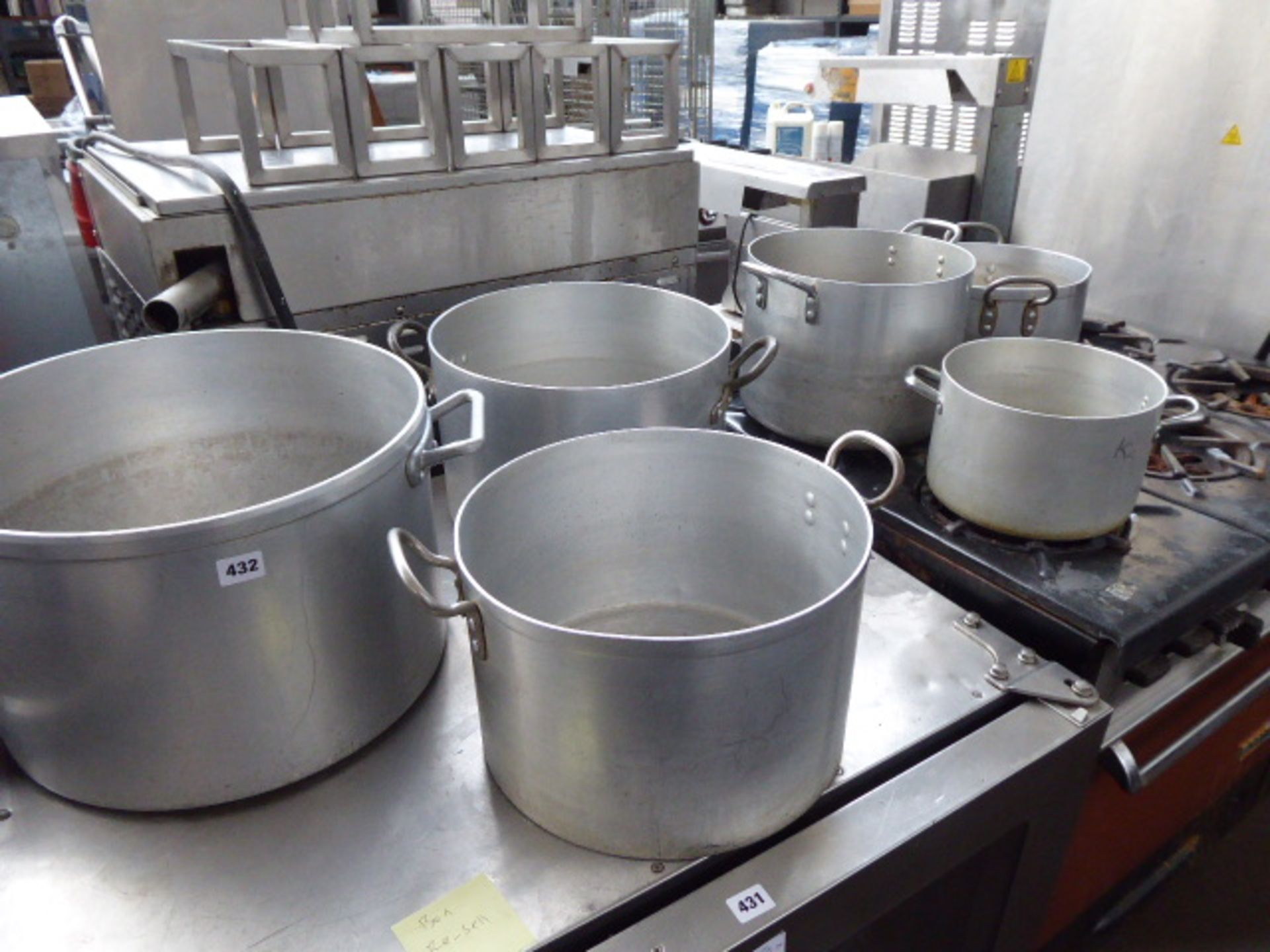 A set of 6 aluminium 2 handled cooking pots in graduated sizes