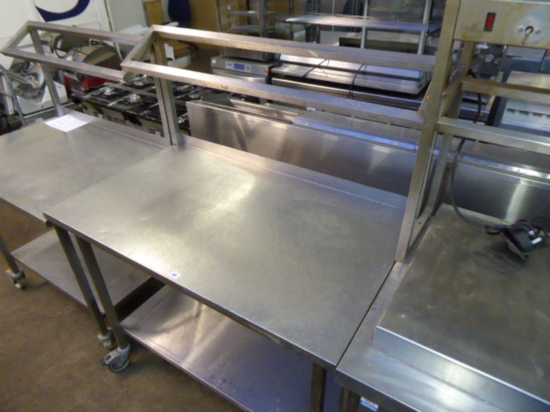 110cm stainless steel preparation table with shelf over and under on castors