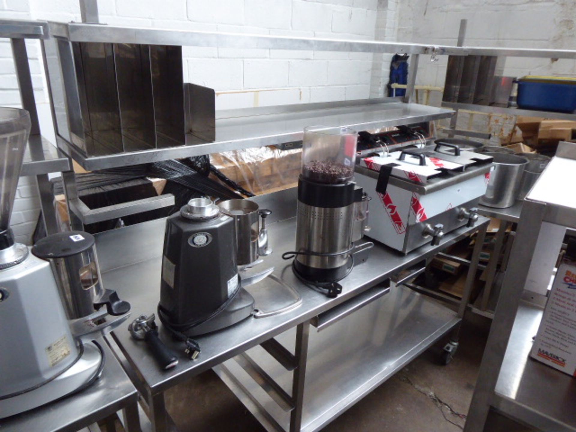 (282) 177cm stainless steel preparation station with 2 shelves over, shelf under, on castors