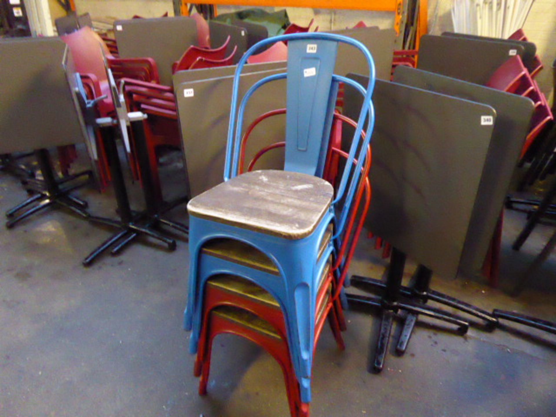 2 red and 2 blue metal frame wood seated vintage style stacking chairs