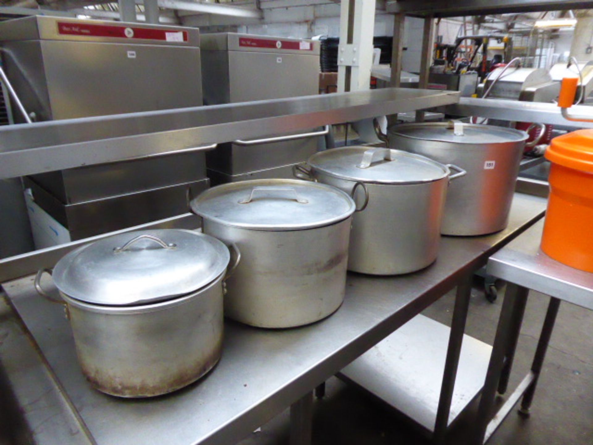 4 large graduated aluminium cooking pots with lids