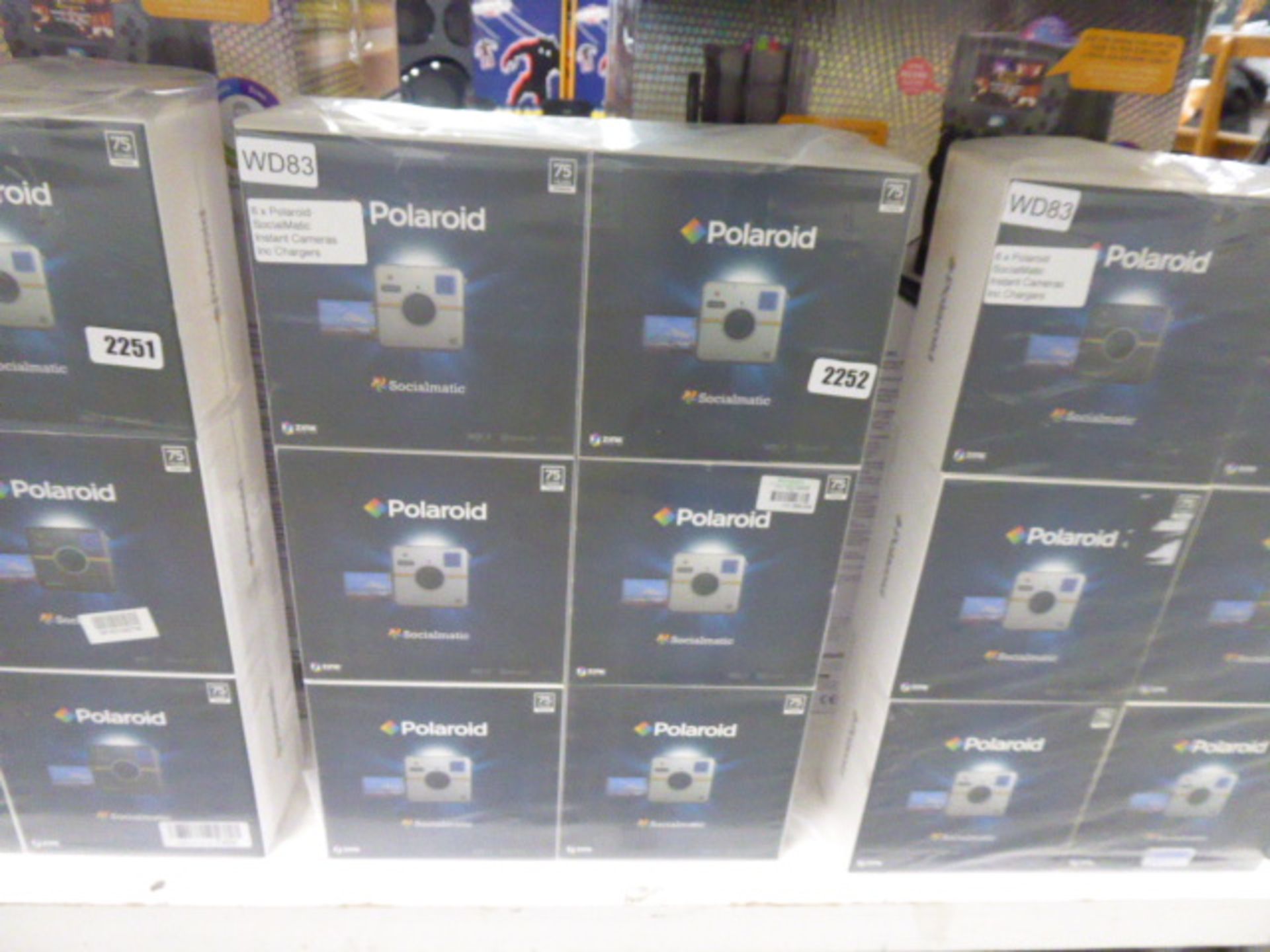 Clear bag containing 6 boxed Sociomatic Polaroid cameras