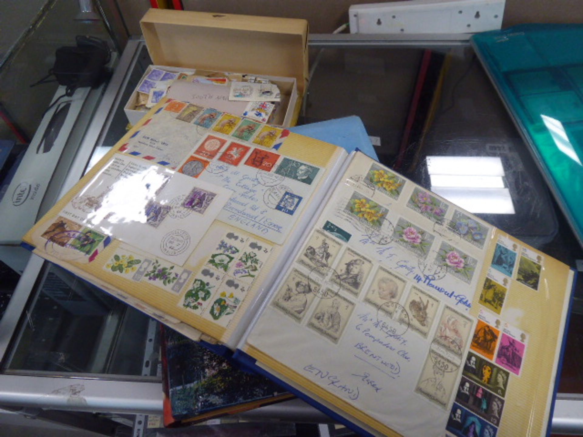 Folders of loose and collectible stamps