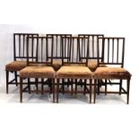 A set of six late George III mahogany dining chairs with reeded vertical splats and square tapering