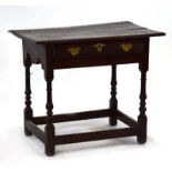 A George II oak lowboy, the frieze with a single drawer, on turned supports joined by stretchers, w.