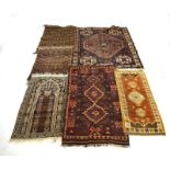 A group of five various early-to-mid 20th century rugs together with a similar kilim, max.