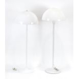 A near pair of white enamelled standard lamps with perspex semi-circular shades,