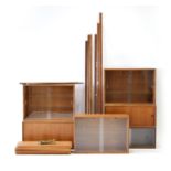 A 1960's Danish teak and glazed modular shelving system in the manner of P.S.