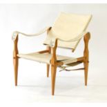 A 1960's 'Safari' chair with fabric seat and back and a beech frame CONDITION REPORT: